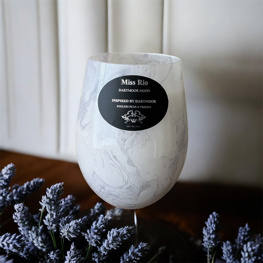 Dartmoor Moon English pear & Freesia luxury vegan candles in a white marble jar.