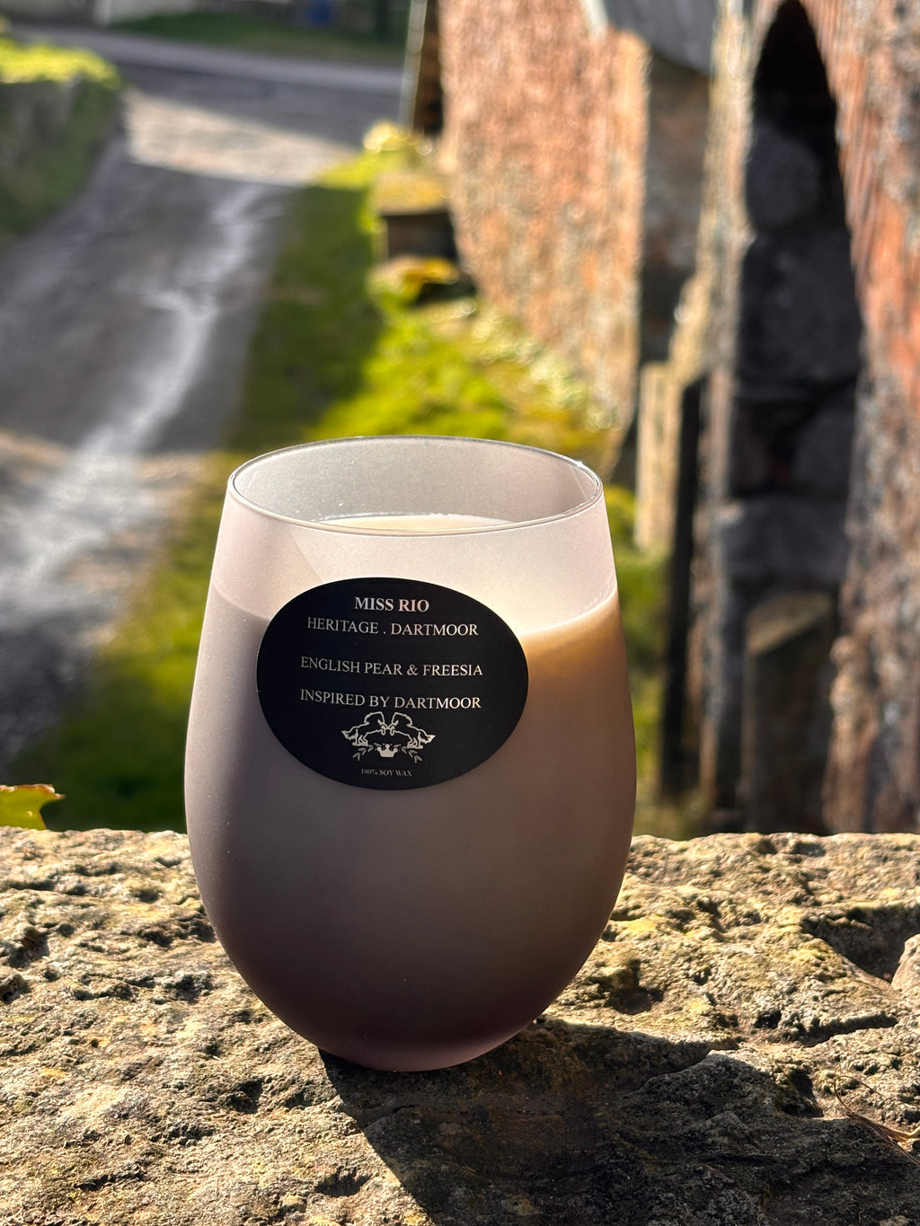 Miss Rio luxury soy wax candle photographed on a working rustic farm the Heritage farm meets the Dartmoor Heritage candle 