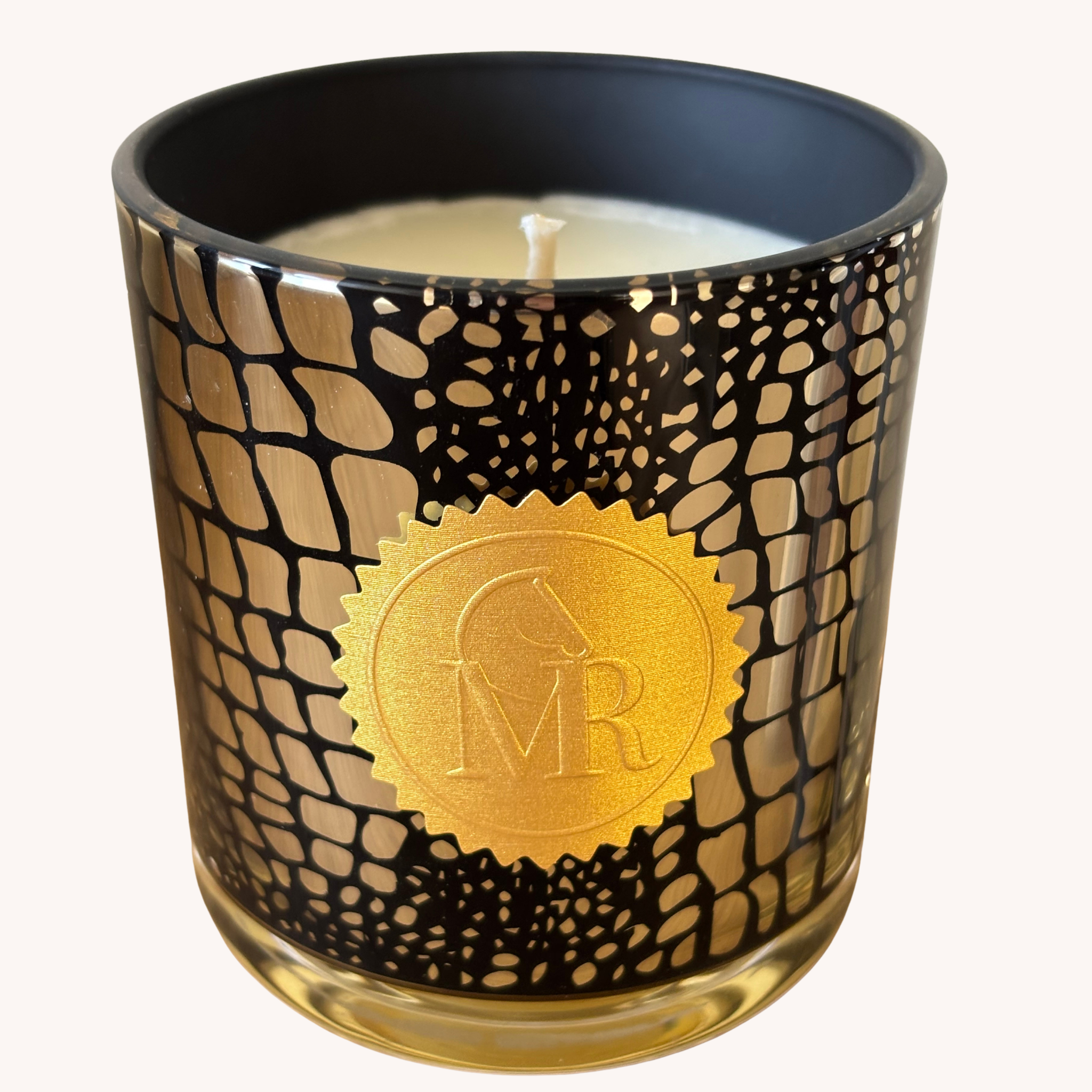 Miss Rio English Pear & Freesia luxury scented candle in a black and gold patterned glass jar with a gold Miss Rio seal, photographed on a clean white background.