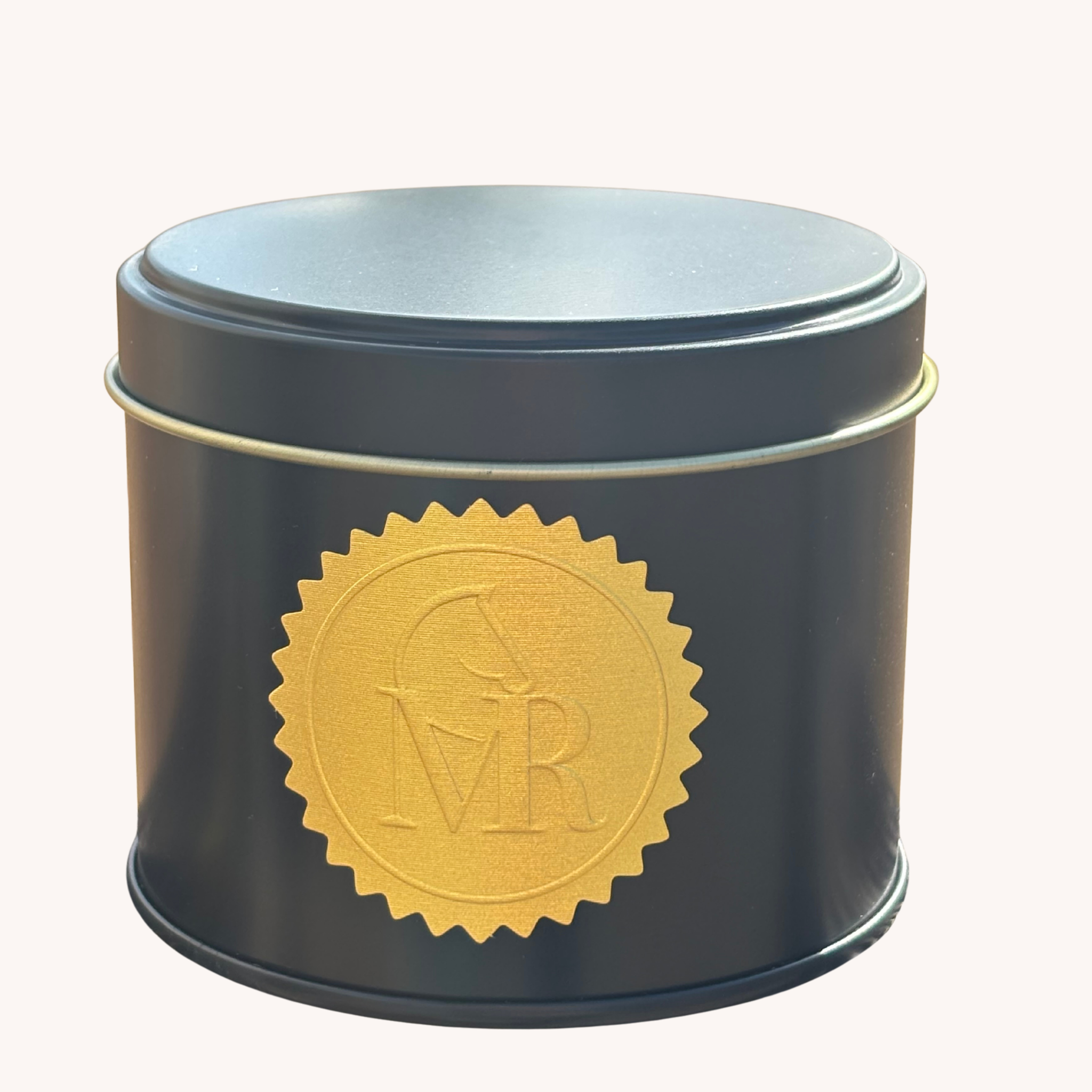Black Miss Rio candle with a gold embossed equestrian logo, shown against a clean white background. 