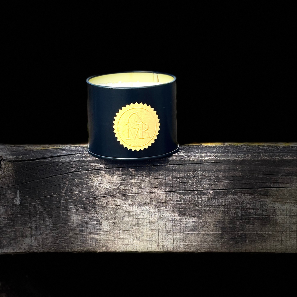Elegant Miss Rio English Pear & Freesia soy candle in a deep green vessel with a luxurious gold embossed logo, inspired by the beauty of the English countryside and equestrian lifestyle.